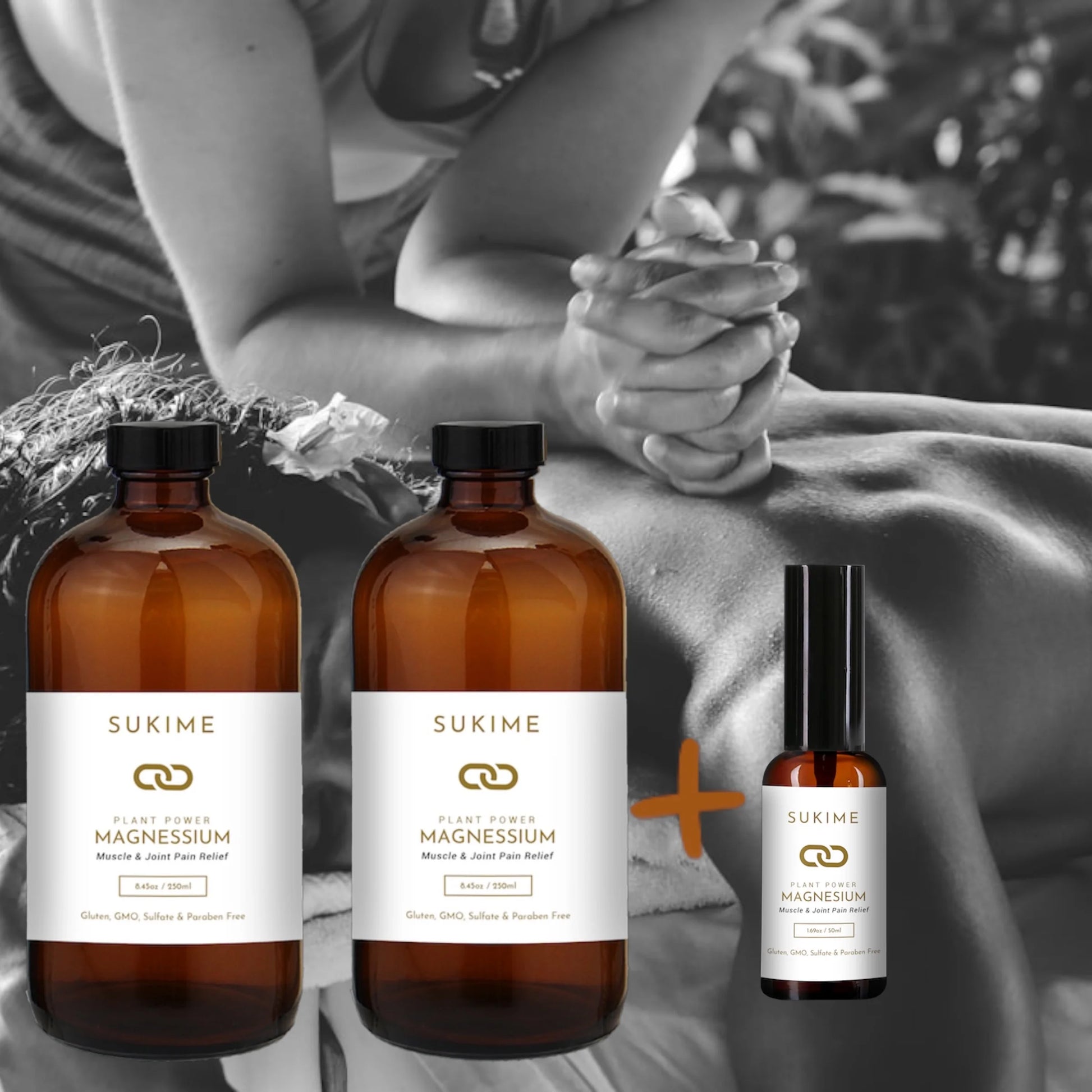 2 large bottles of Magnesium oil + 1 small bottle in front of woman giving man massage